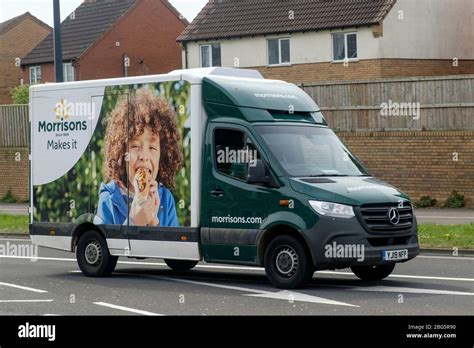 A Morrisons delivery van out and about, making deliveries during the Covid-19 pandemic lockdown ...