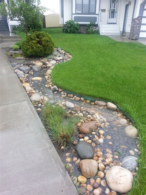 Dry stream bed functions in spring rain! | Rain garden design, Rock ...