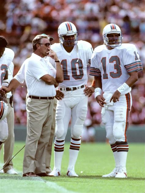 Miami Dolphins quarterback Dan Marino with coach Don Shula and Don Strock (10) in 1985 Miami ...