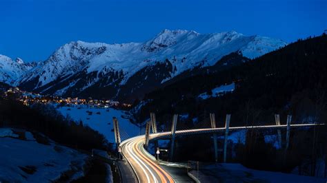 mountains, road, night, snow, snowy mountain, light trails, viaduct, bridge, dusk, city lights ...