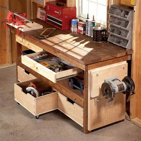 a workbench with drawers and tools in it