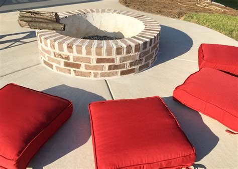 Decorate for a casual gathering at your fire pit. Red seat cushions match well with the Vienna O ...