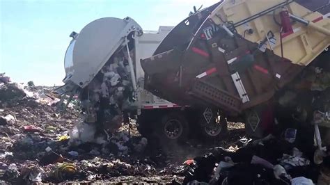 Garbage Trucks Unloading At The Dump - YouTube