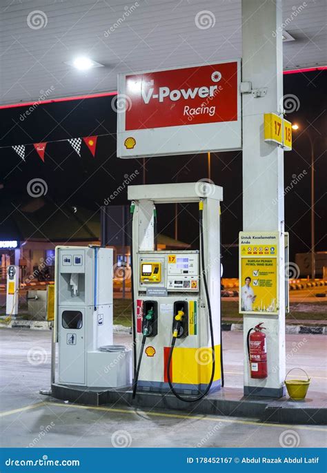 Petrol Pump Filling Nozzles at Shell Gas Station Editorial Photography - Image of auto, nozzle ...