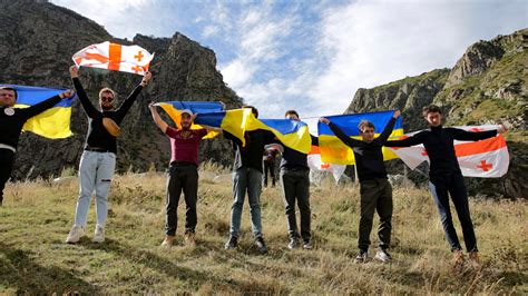 Protest at Georgian border as Russians arrive