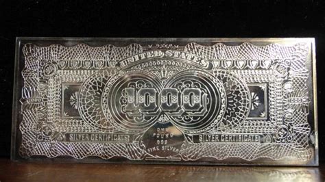 16 OZ. .999 FINE SILVER BAR IN THE FORM OF ONE THOUSAND SILVER DOLLAR BAR, WITH COA FROM ...