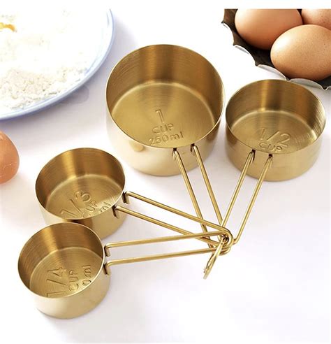 Gold Measuring Cups + Spoons in 2021 | Measuring cups, Beautiful measuring cups, Flatware set