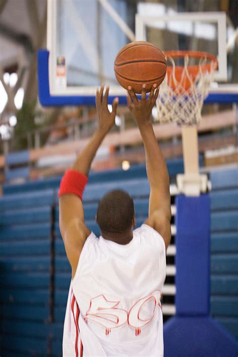 Basketball Player Shooting Photograph by Gustoimages/science Photo ...