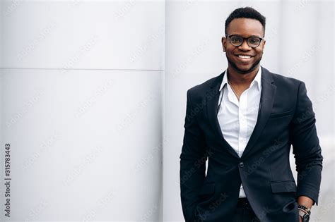 Smiling handsome african american man in stylish formal suit, outdoors ...