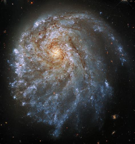 ESA - Hubble inspects a contorted spiral galaxy