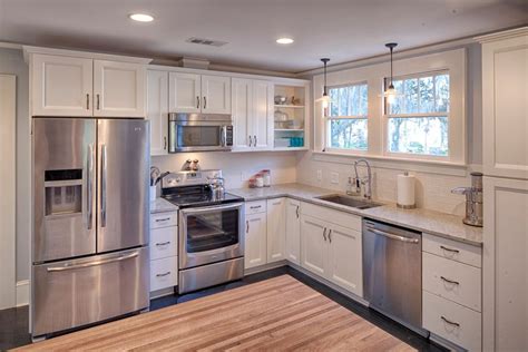 the kitchen is clean and ready for us to use it's stainless steel appliances