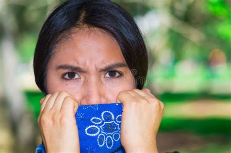 Young Brunette Woman Wearing Blue Bandana Covering Half of Face ...