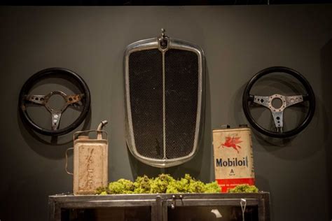 Old car parts recreated as wall art in the Four Hands Showroom | Man cave home bar, Truck ...