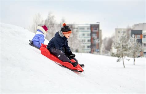 Kids Sliding in Winter Time Stock Image - Image of freeze, cheerful: 27143695