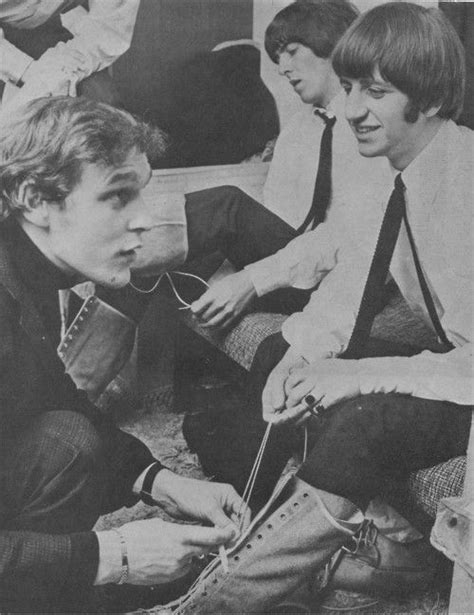 Neil Aspinall helps Ringo with his boot during the 1964-1965 Christmas show. | Beatles christmas ...