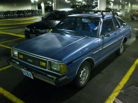 OLD PARKED CARS.: 1982 Datsun 210 Hatchback.