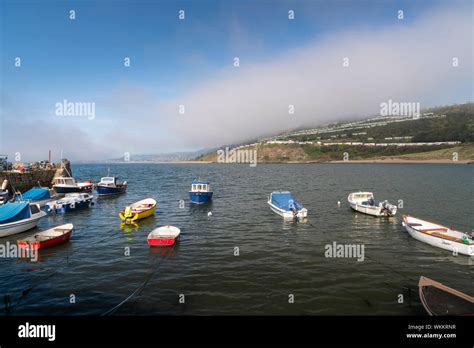 Small fishing boats in the harbour at Pettycur Bay, Kinghorn, Fife ...