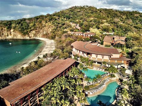 Aerial view of Four Seasons Hotel Costa Rica at Peninsula Papagayo building, resort by sand ...