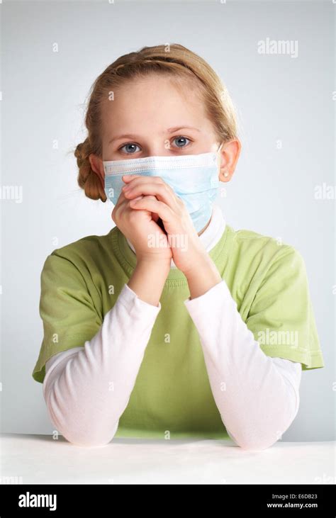 Portrait of a sad girl in face mask Stock Photo - Alamy