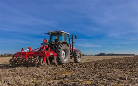 Tractor With Plough At Work Stock Photo - Download Image Now - iStock