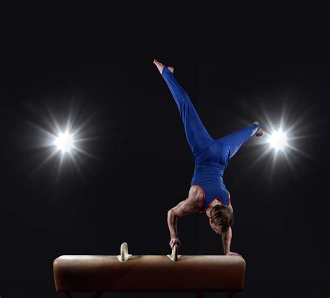 Male Gymnast Doing Handstand On Pommel Photograph by Mike Harrington ...