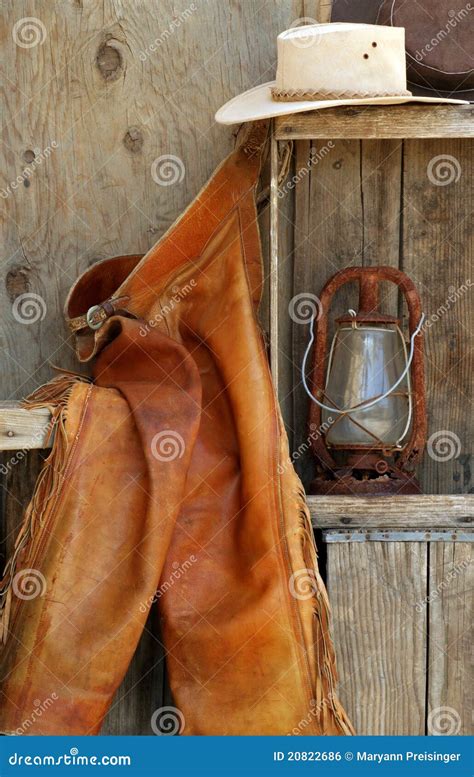 Leather Chaps, Cowboy Hats, Lantern On Shelf Stock Photo - Image of ...