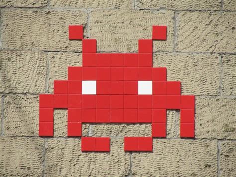 Urban street artist Invader has installed tile mosaics modeled after Space Invaders 8-bit video ...