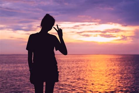 Premium Photo | The girl silhouette with sunset background