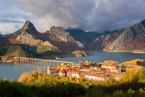 Riano cityscape at sunrise with mountain range landscape during autumn ...