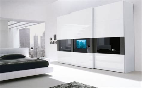 Super Modern Bedroom Wardrobe With A TV Built In The Door - DigsDigs