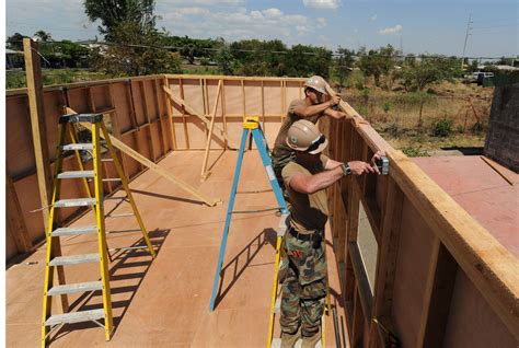 File:US Navy 110323-N-WX845-117 Construction Electrician 2nd Class Mark Decker and Equipment ...