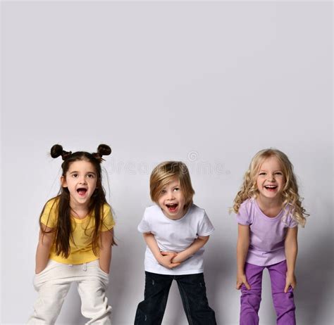 Funny Kids Dressed in Colorful Casual Clothes. they are Screaming while ...