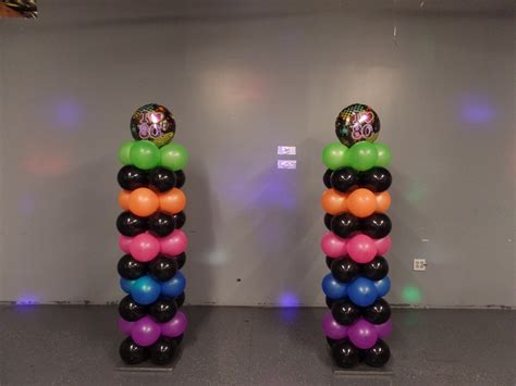 80's theme balloon columns using black and neon balloons. Please visit my youtube channel ...