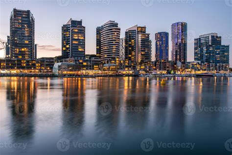 The reflection of Docklands waterfront area in Melbourne city ...