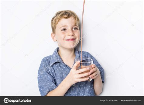 Happy smiling child drinking chocolate milk isolated on white — Stock Photo © Lopolo #167501680