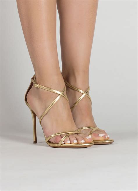 Gold leather strappy high heel sandals . PURA LOPEZ