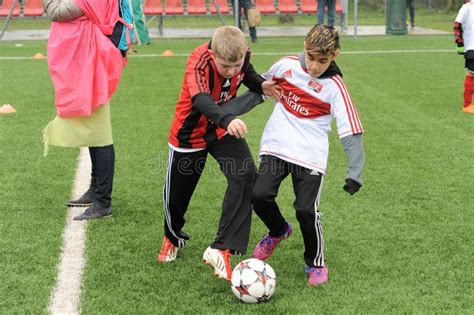 Kids` Soccer, Children Play Ball in Football School Editorial Photo ...