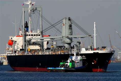 Freighter in Port with Tugboat, Port of Brownsville 2017 10209545 Stock Photo at Vecteezy