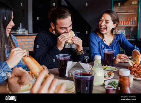 Mexican people eating Tacos al Pastor in a Taqueria in Mexico city Stock Photo - Alamy