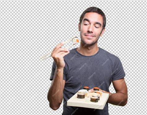 Premium PSD | Young man eating sushi