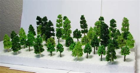 48 Piece Set of N Scale Mixed Color Trees 12 Pieces in 4 Sizes 2 3/8,1 3/4,1 5/8,&1 1/4. Comes ...