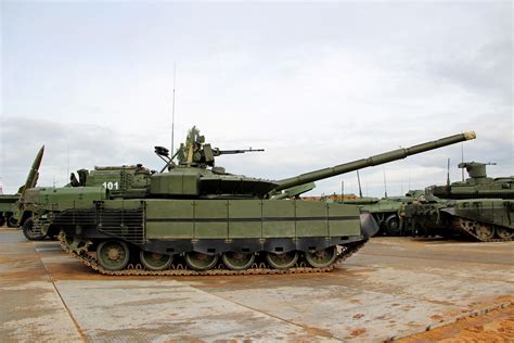 tanks are lined up on the ground near each other