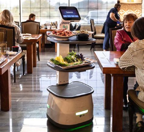 New Restaurant Serving Robot Works Tables and Assists Staff