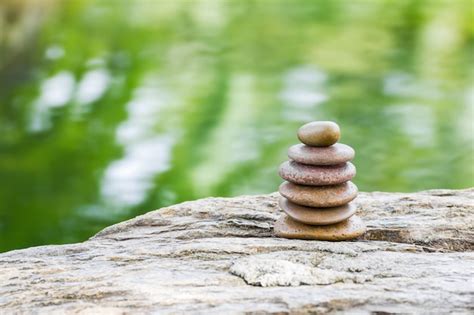 Premium Photo | Stack of zen rocks in garden