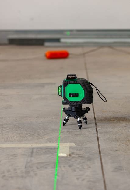 Laser level measuring tool in construction site. | Premium Photo