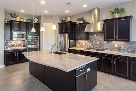 Love this kitchen with dark cabinets & light granite countertops Trendy ...