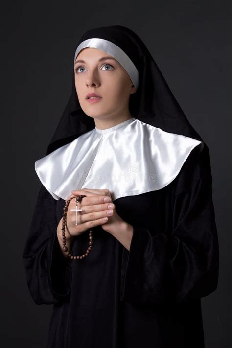 Young Beautiful Woman Nun Praying with Rosary Over Grey Stock Photo - Image of beautiful, people ...