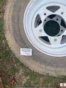 (2) TRAILER TIRES & RIMS - EK Auctioneers LLC