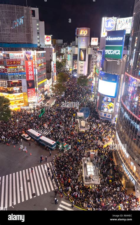 Tokyo policeman on duty at Shibuya crossing during Halloween celebration. Halloween has become ...