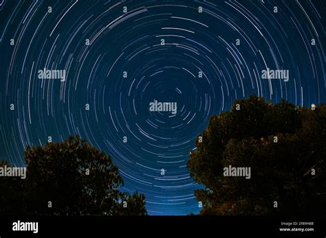 Star trails around Polaris, during Full Moon Stock Photo - Alamy